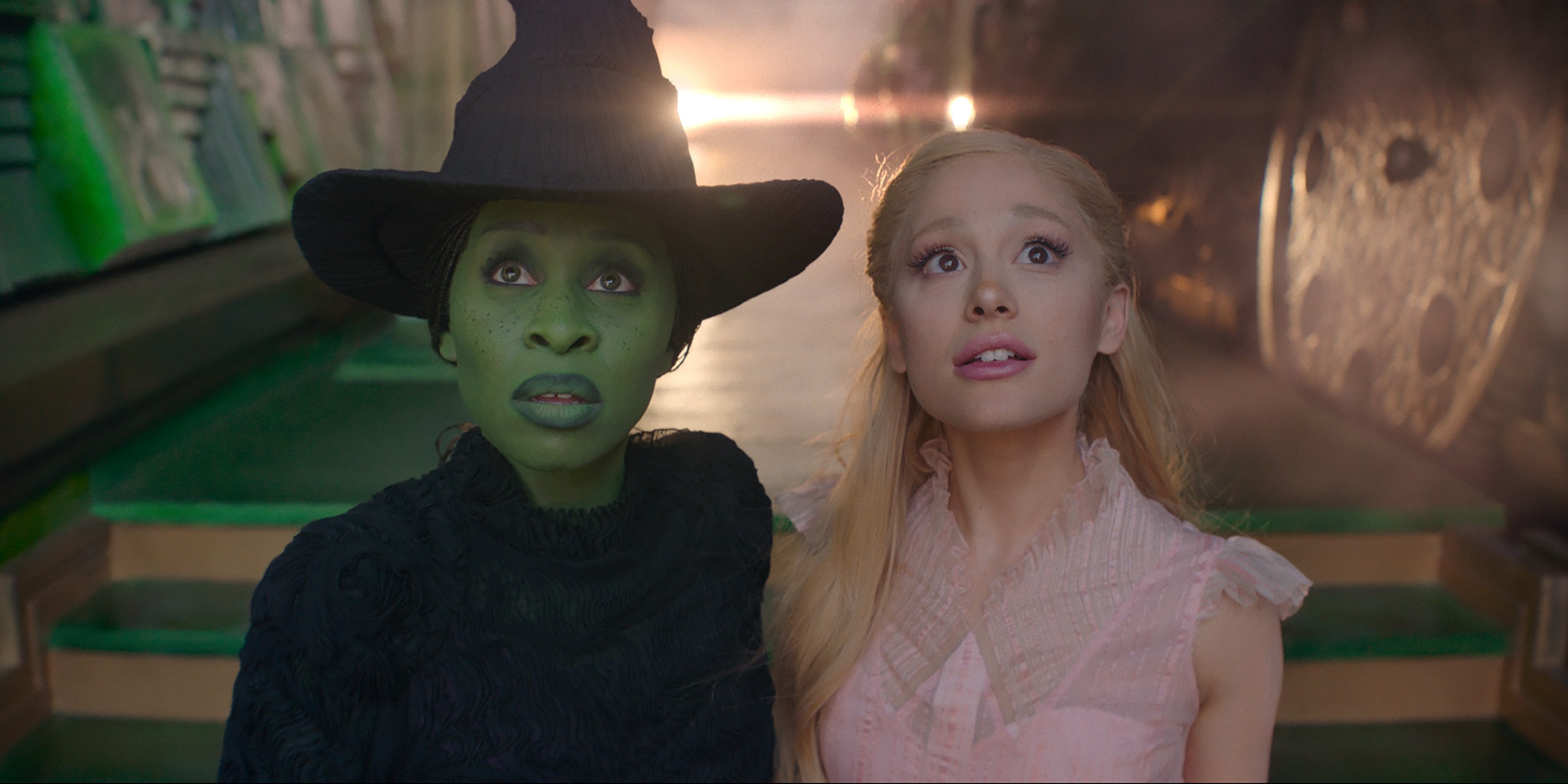 L to R: Cynthia Erivo is Elphaba and Ariana Grande is Glinda in WICKED, directed by Jon M. Chu