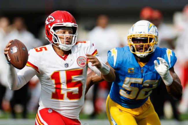 INGLEWOOD, CALIFORNIA - SEPTEMBER 29: Patrick Mahomes #15 of the Kansas City Chiefs looks to throw the ball as Khalil Mack #52 of the Los Angeles Chargers applies pressure during the third quarter at SoFi Stadium on September 29, 2024 in Inglewood, California. (Photo by Kevork Djansezian/Getty Images)