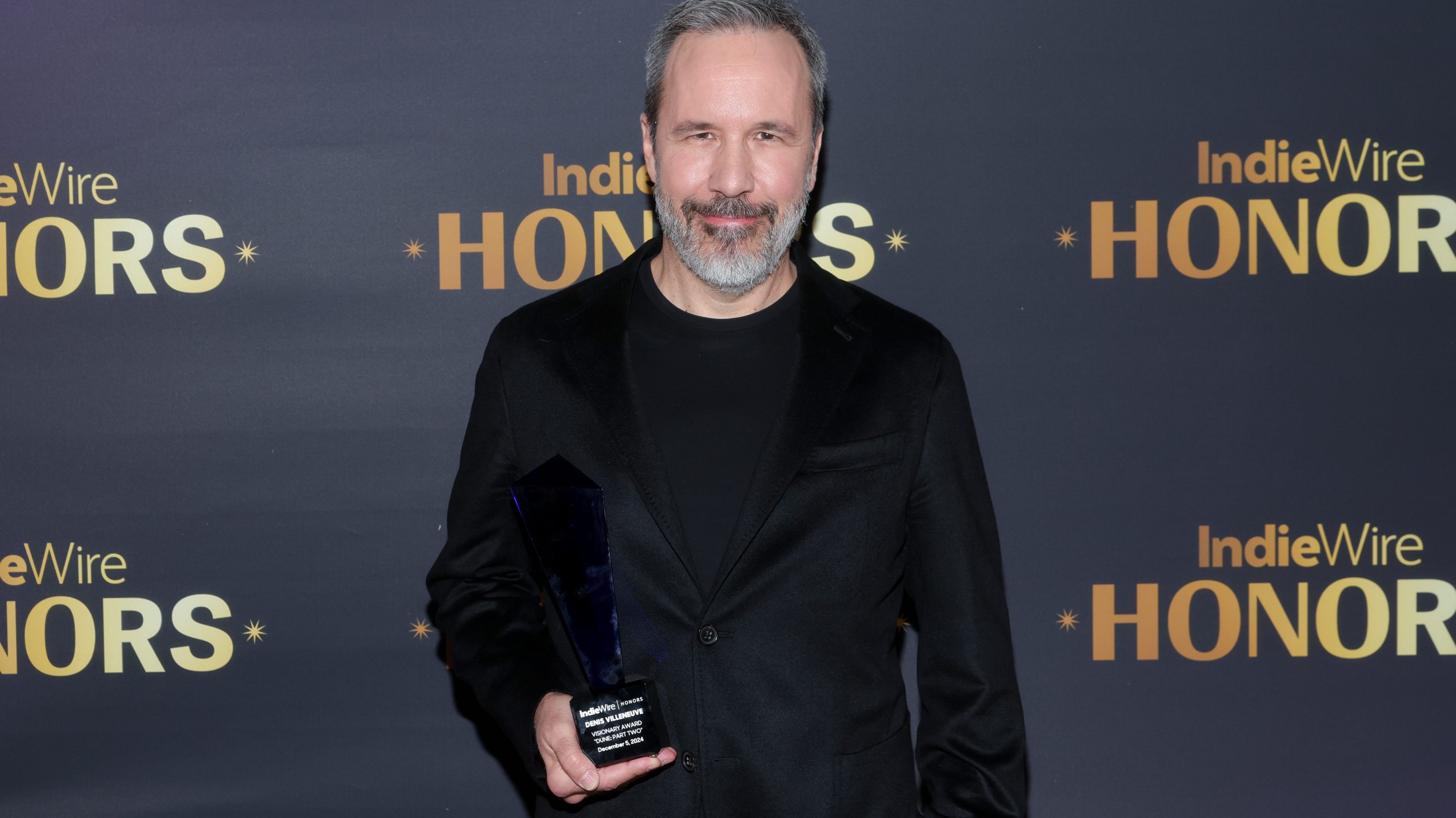 Denis Villeneuve poses with the Visionary Award for "Dune: Part Two" at IndieWire Honors 2024 at Citizen News on December 05, 2024 in Los Angeles, California.