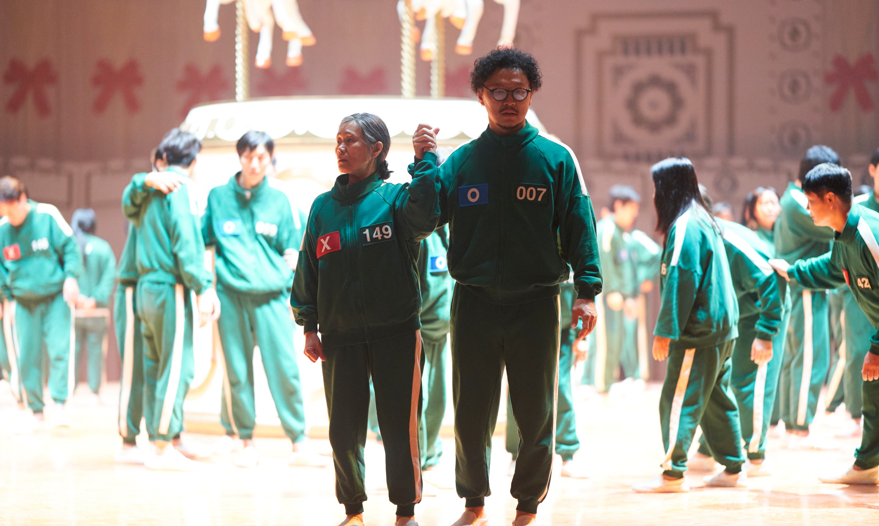 Squid Game S2 (L to R) Kang Ae-sim as Jang Geum-ja, Yang Dong-geun as Park Yong-sik in Squid Game S2 Cr. No Ju-han/Netflix © 2024